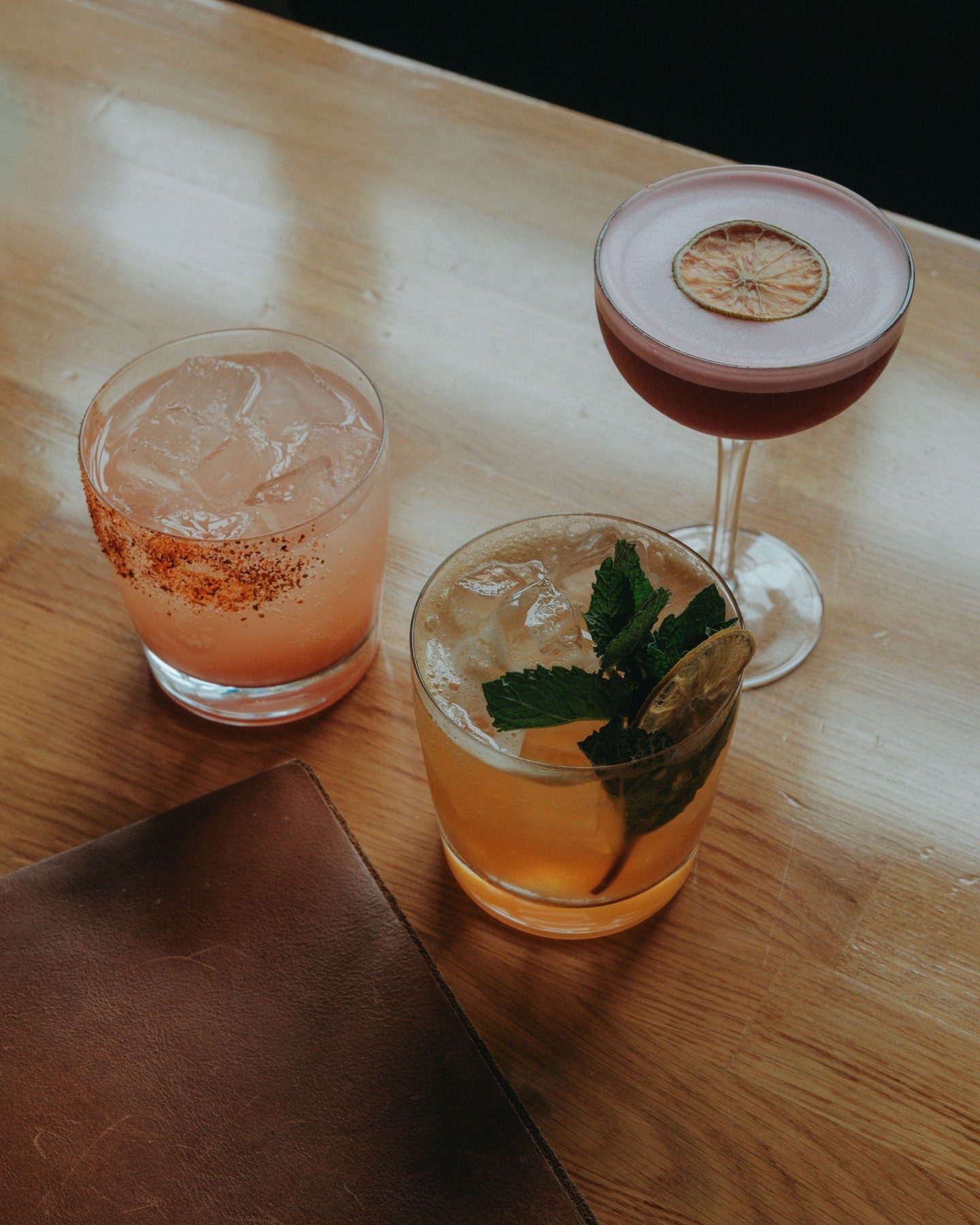 Three cocktails on the bar